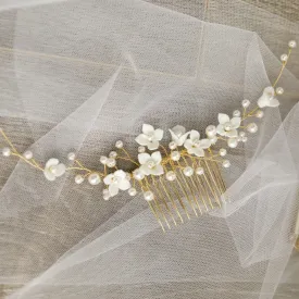 C142. ivory clay flower hair comb for bride, available in silver and gold.